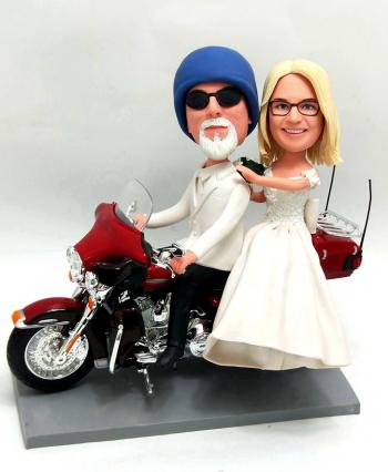Custom couple bobbleheads on Motorbike wedding cake topper